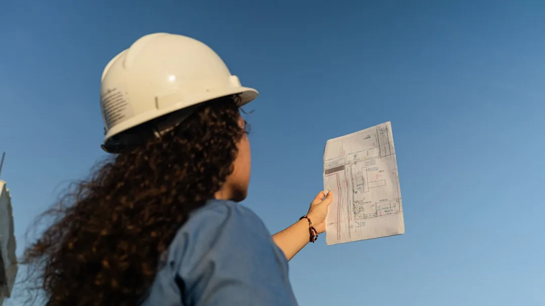 Professional contractor reviewing a project estimate with a homeowner - foundation waterproofing contractor Fredericksburg